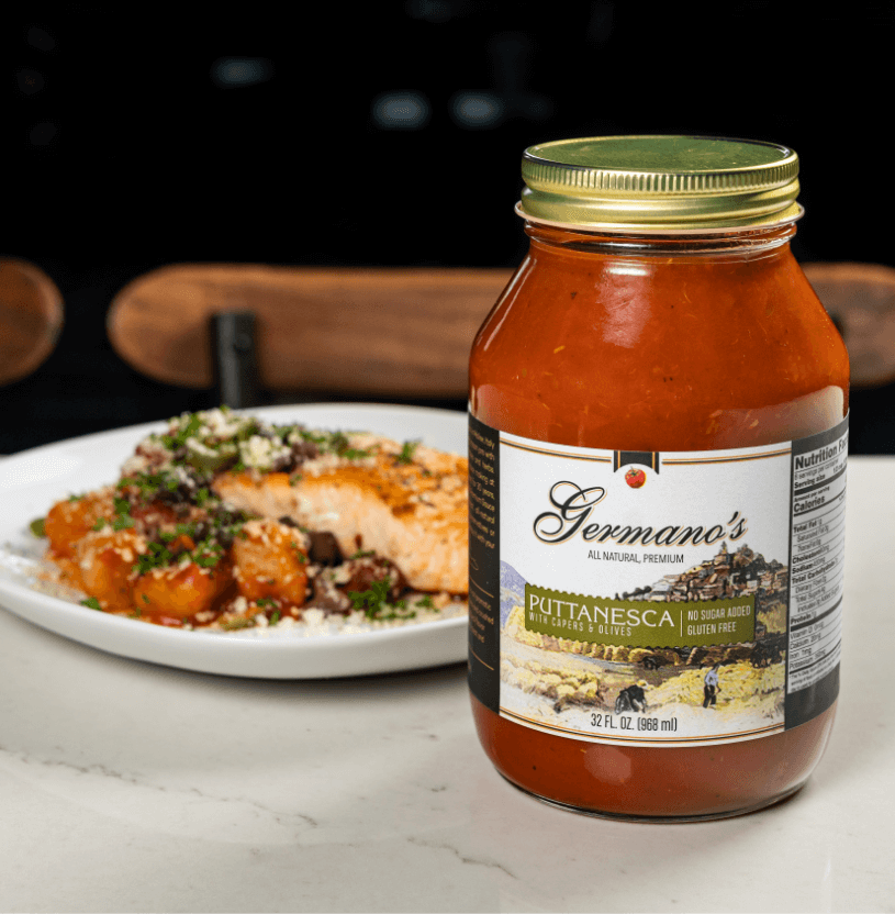 jar of pasta sauce with food in background